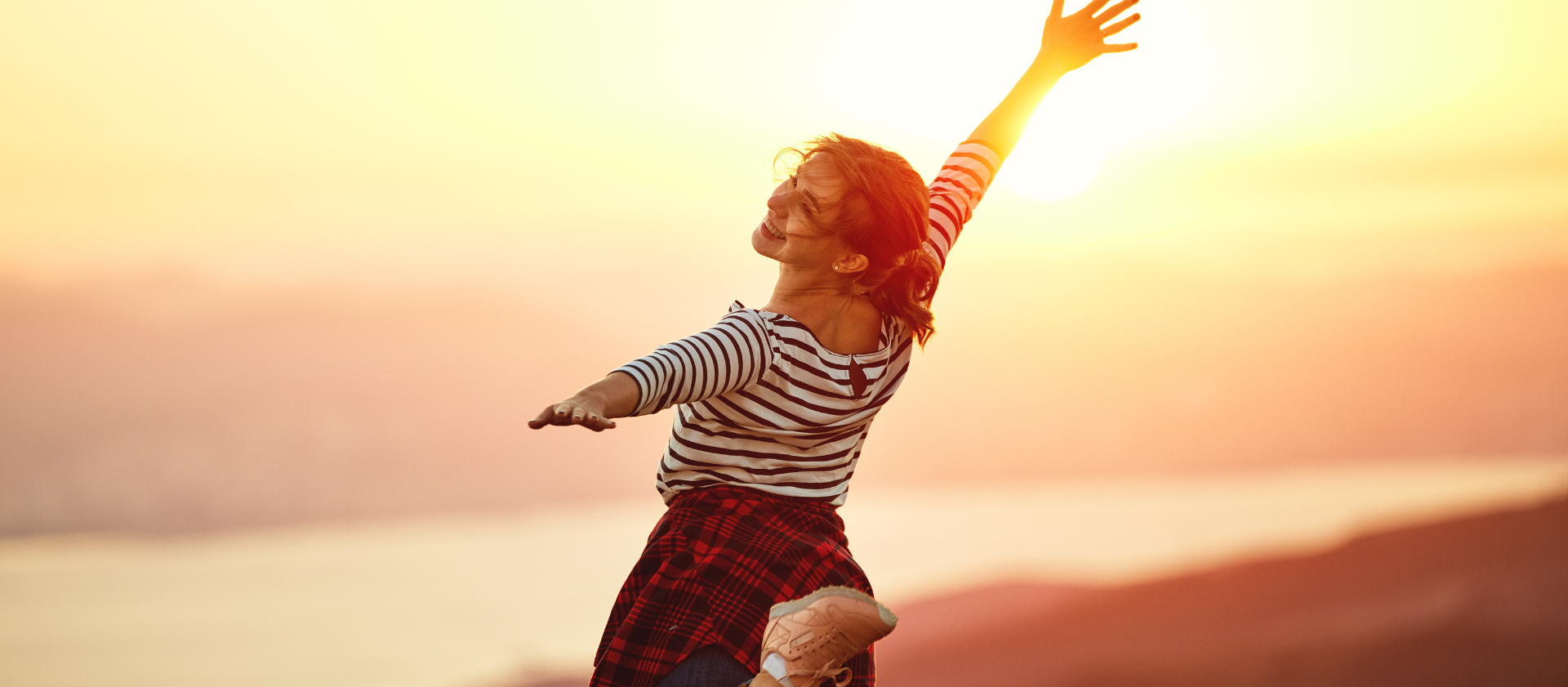 riwospine-patients-centered-spine-care.png Healthy young woman jumping, free from back pain