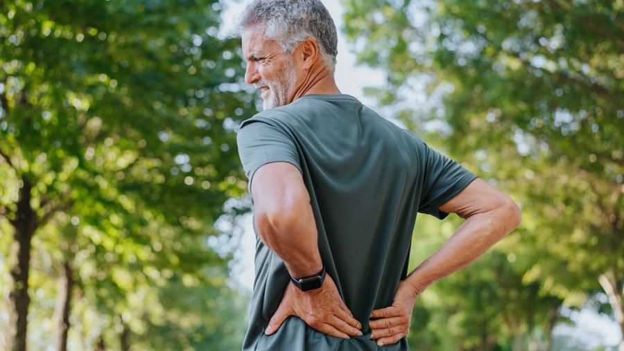 riwospine-lower-back-pain-man-outdoors-treatment.png Man with lower back pain outdoors – chronic spinal pain and RIWOspine treatment solutions