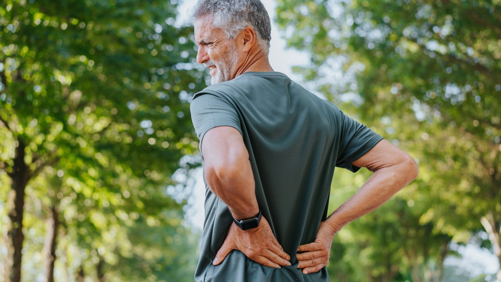 riwospine-lower-back-pain-man-outdoors-treatment.png Man with lower back pain outdoors – chronic spinal pain and RIWOspine treatment solutions