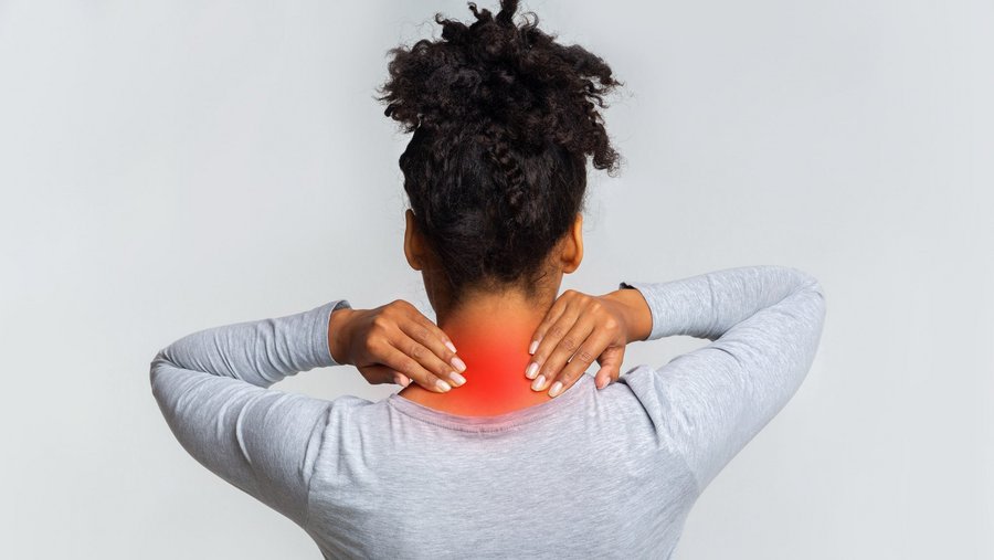 riwospine-neck-pain-cervical-spine-treatment.png Woman with neck pain holding cervical spine – cervical disc disorder or nerve compression